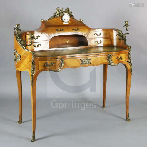 A Louis XV style kingwood and ormolu mounted bureau à rognon, the raised back inset with an eight