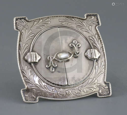 A George V Arts & Crafts silver and moonstone mounted photograph frame by Ramsden & Carr, London,