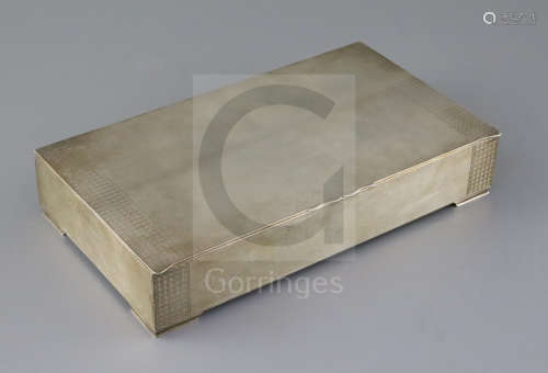A George V engine turned silver rectangular cigarette box, Padgett & Braham Ltd, the lid with
