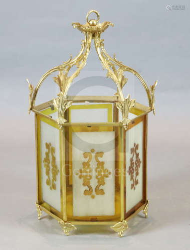 A Victorian style ormolu hall lantern, with foliate scroll and ivy leaf frame, inset with frosted