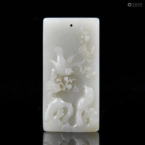 A CARVED WHITE JADE PENDANT