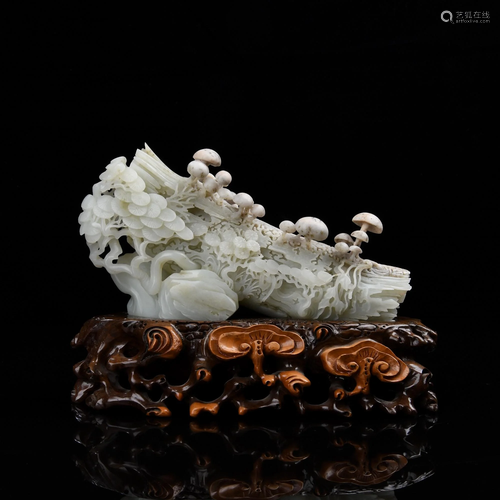 A CARVED WHITE JADE MODEL