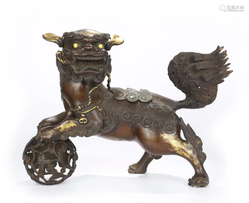 A GILT-BRONZE FIGURE OF LION.QING PERIOD