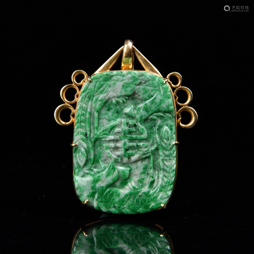 A CARVED JADEITE PENDANT