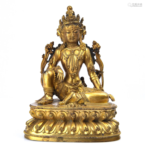 A GILT-BRONZE FIGURE OF GUANYIN.MING PERIOD