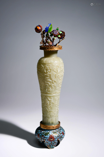 A CARVED WHITE JADE VASE WITH A CLOISONNE E…