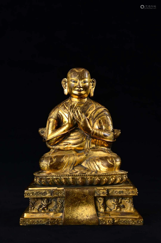 A GILT-BRONZE FIGURE OF GURU.QING PERIOD