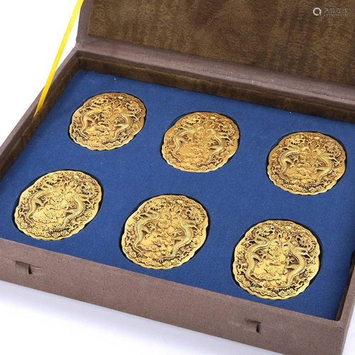 A SET OF SIX GILT-BRONZE OFFICER BADGES .…