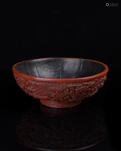 A CARVED CINNABAR LACQUER'DRAGON' BOWL.Q…