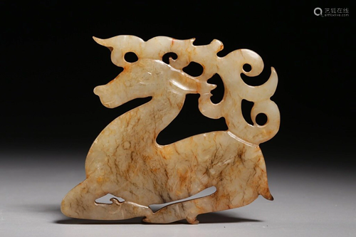 A CARVED JADE PENDANT