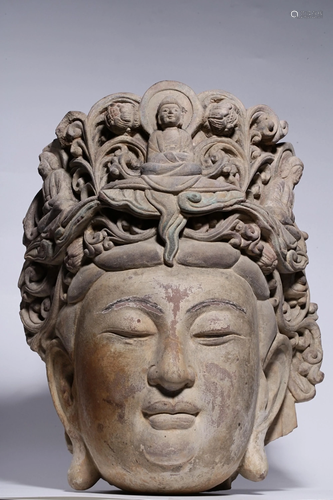 A CARVED STONE BUDDHA HEAD