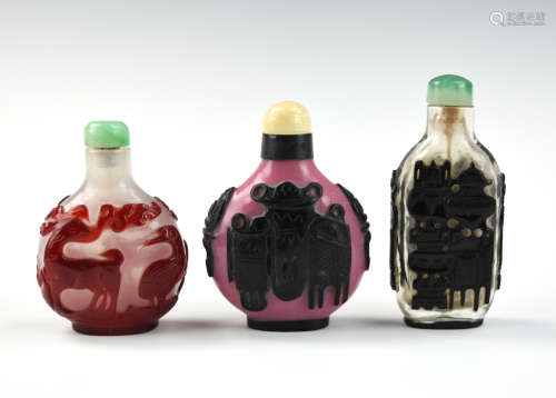 Three Chinese Overlay Glassware Snuff Bottles