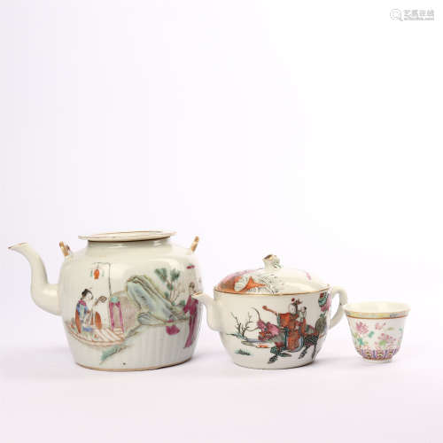 A set of teapots and cups decorated with famille rose figures and flowers