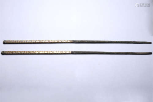 A pair of gold and silver chopsticks