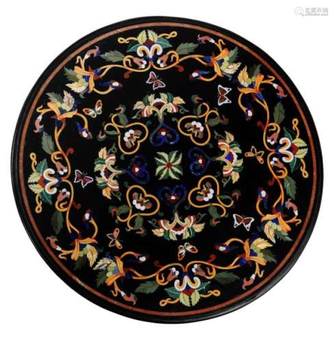 A round tabletop in Italian pietra dura, decorated…