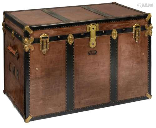 A large leather and brass travelling trunk, marked…
