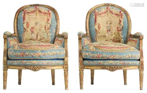A pair of carved, gilt and patinated walnut Louis …