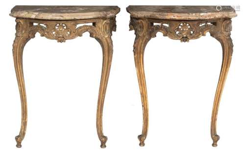 A pair of gilt wooden Rococo style consoles, with …