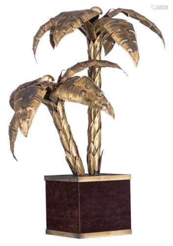A vintage brass Maison Jansen palm tree lamp on a …
