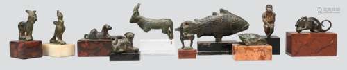 A collection of bronze animal amulets and models. …