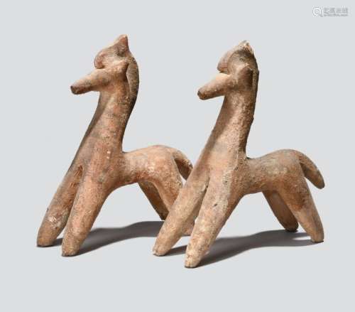 A pair of Cypriot bichrome ware models of horses. …