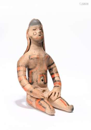 An Amazonian seated female figure. Brazil. Earthen…
