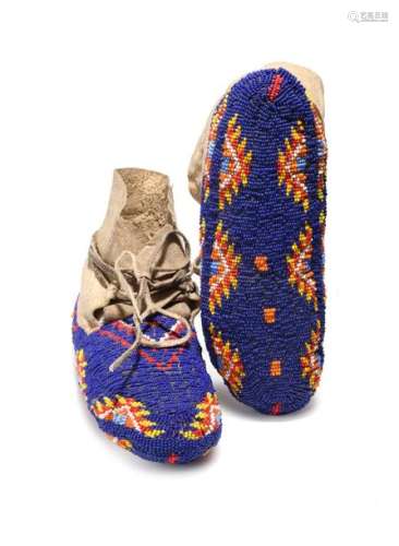 A pair of Sioux fully beaded moccasins. Plains. Hi…
