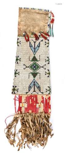 A Sioux pipe bag. Plains. Buckskin, coloured glass…