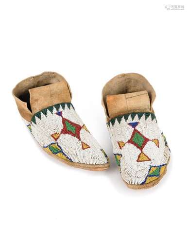 A pair of Ute moccasins. Great Basin. Buckskin, ra…