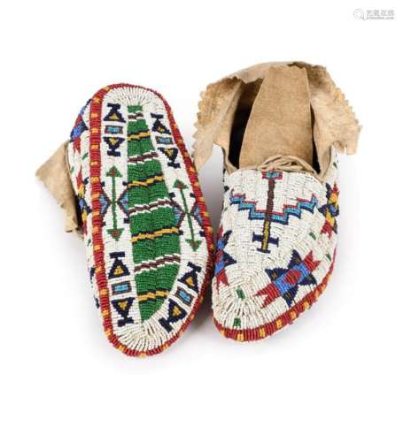 A pair of Western Sioux fully beaded moccasins. Pl…