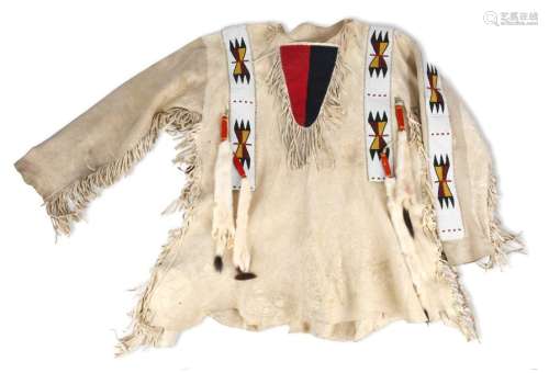 A Blackfoot shirt. Plains. Tanned buckskin with fr…