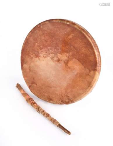 A Blackfoot hand drum. Plains. Bentwood with a raw…