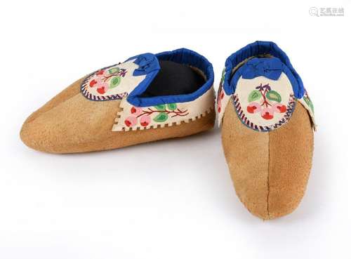 A pair of Athapaskan child~s moccasins. Subarctic.…