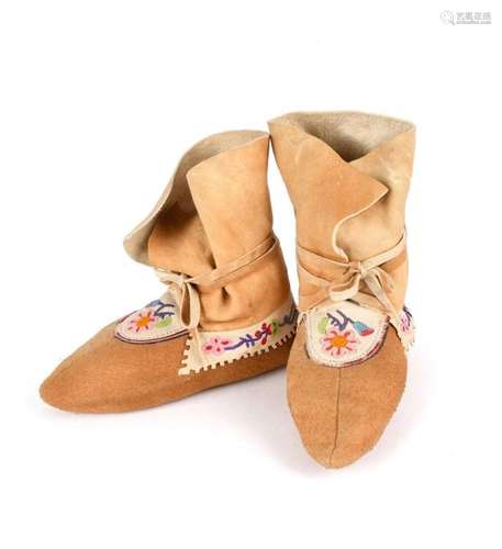 A pair of Athapaskan child~s moccasins. Subarctic.…