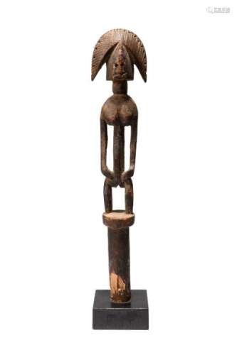 A Bambara figural staff finial. Mali. With a stand…