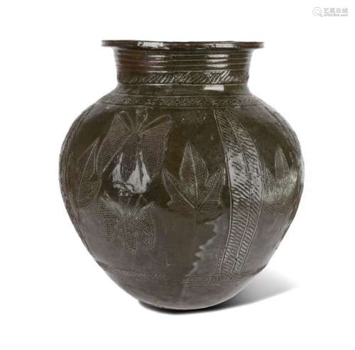 An Abuja water pot. Nigeria. Green glazed pottery,…