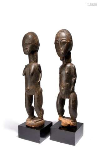A Baule couple. Ivory Coast. Male and female stand…