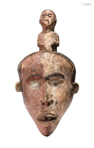 A Gabon mask. With overlaid glass eyes and pigment…