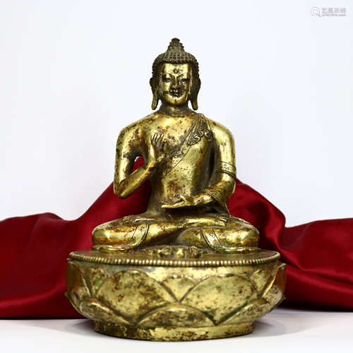 A CHINESE GILD COPPER STATUE OF SAKYAMUNI