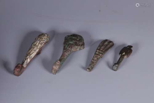 GROUP OF FOUR ARCHAIC BRONZE CAST AND CARVED BELT HOOKS