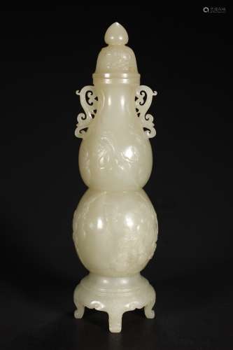 A CHINESE WHITE JADE CARVED GOURD-SHAPED VASE