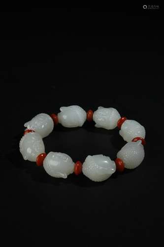 HETIAN WHITE JADE CARVED 'BUDDHA HEAD' BEAD BRACELET