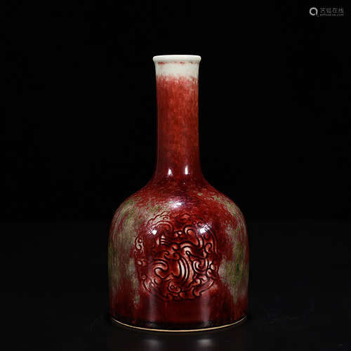 A CHINESE FLOWER CARVED RED PORCELAIN BELL-SHAPED ZUN