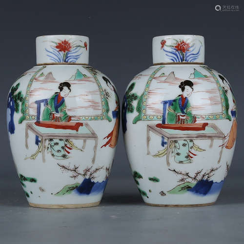 A PAIR OF CHINESE MULTI COLORED WOMAN PAINTED PORCELAIN JARS WITH COVER