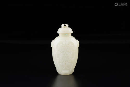 A CHINESE JADE CARVED VASE ORNAMENT WITH COVER