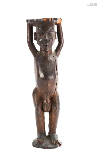 WEST AFRICAN FIGURE OF A MALE HOLDING TRAY