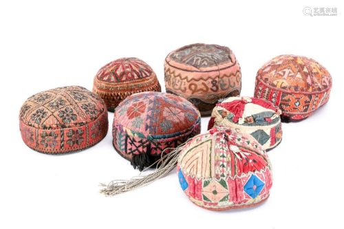 GROUP OF SEVEN (7) TRIBAL HATS, AFGHANISTAN