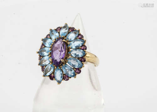 A topaz and amethyst 9ct gold dress ring, the oval setting with navette shaped marquise mixed cut