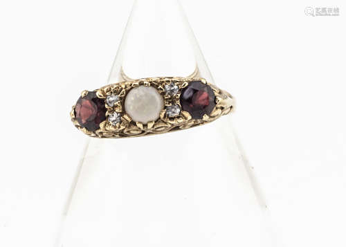 A 9ct gold Victorian style opal, topaz and garnet dress ring, the central white precious opal in