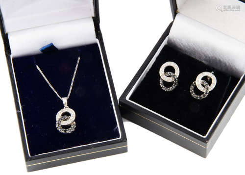 A diamond suite of jewels, including a pendant and pair of earrings, of double loop design, set with